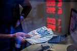Turkish lira firms as markets reopen with eye on US row